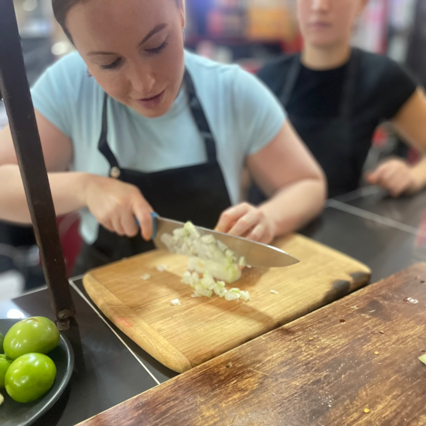 Chopping Onion. The hands on work cooking class by Pachoa México at San Juan Market, México City.